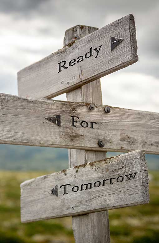 ready for tomorrow text on wooden signpost outdoors in nature